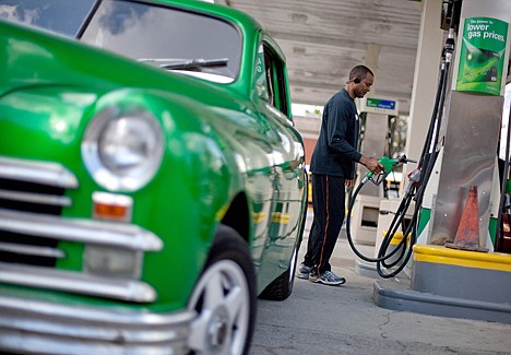 &lt;p&gt;Delta Brogden, of Atlanta, pumps gas Friday at a station in Atlanta. Gasoline prices rose again Friday and are now averaging more than $4 in six states plus Washington, D.C. Retail gasoline prices were up a penny on Friday to a national average of $3.831 per gallon, according to AAA, Wright Express and Oil Price Information Service.&lt;/p&gt;