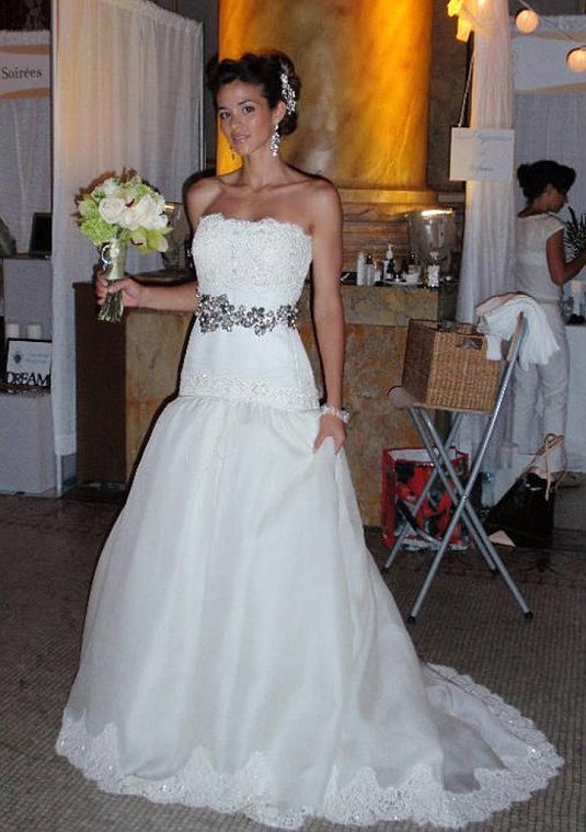 Karol Scott-Tracy dons a wedding gown to prepare for a modeling session in Miami.
