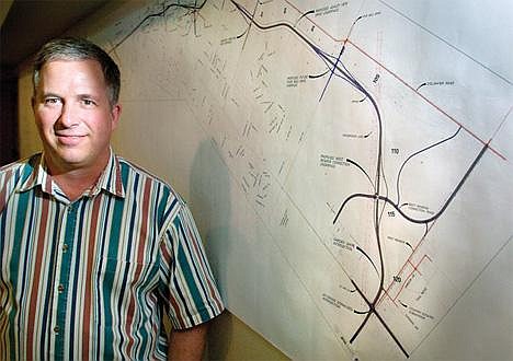 Chris Jordan/Daily Inter Lake&lt;br&gt;J. Gary Kalberg, the Department of Transportation's construction engineer for western Montana, stands in front of a map of the planned bypass of U.S. 93 west of Kalispell.