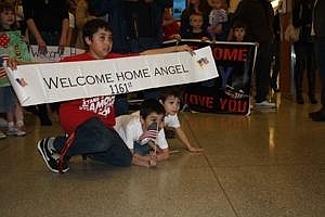 Children welcome home members of the 1161st Transportation Company.