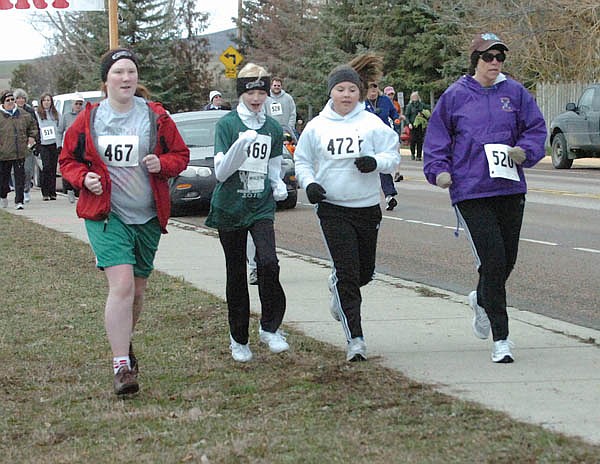 Runners get going during the March Meltdown last Saturday.
