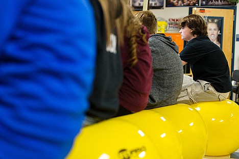 &lt;p&gt;Coeur d&#146;Alene High School sophomore Thys Ballard works on an assignment Thursday during his commercial photography class. The instructor, Bruce Twitchell, recently replaced his class seats with exercise balls.&lt;/p&gt;
