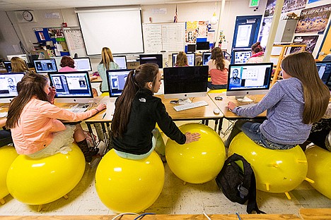 &lt;p&gt;Allison Hensley, center, leans over to offer advice to a classmate.&lt;/p&gt;
