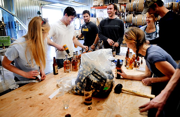 &lt;p&gt;Marcus Duffey, center in white, owner of Black Star Draught House/Great Northern Brewery and others from the Great Northern and from Glacier Distilling share a laugh as they bottle the new Wheatfish Whiskey on Friday, March 9, in Coram.&lt;/p&gt;