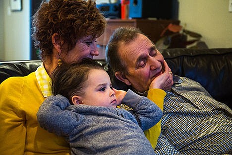 &lt;p&gt;Barbara Powers watches T.V. with her husband Pat Powers and her great-nephew Sawyer Harns, 2, at their home in Coeur d&#146;Alene. Pat was diagnosed with early onset Alzheimer&#146;s in 2008 and Barbara decided to care for him at home after Pat&#146;s care centers raised their prices. &#147;This is an expensive disease,&#148; Barbara said.&lt;/p&gt;