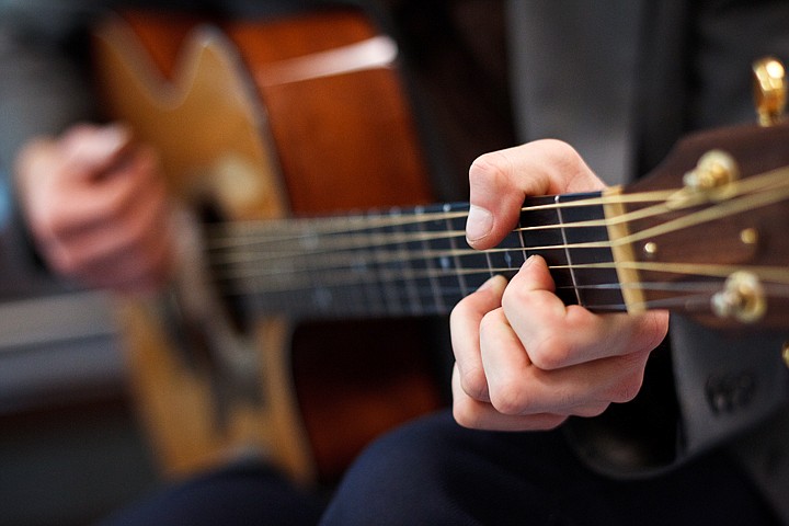 &lt;p&gt;Daniel Mills plays chords while teaching fundamental guitar techniques.&lt;/p&gt;