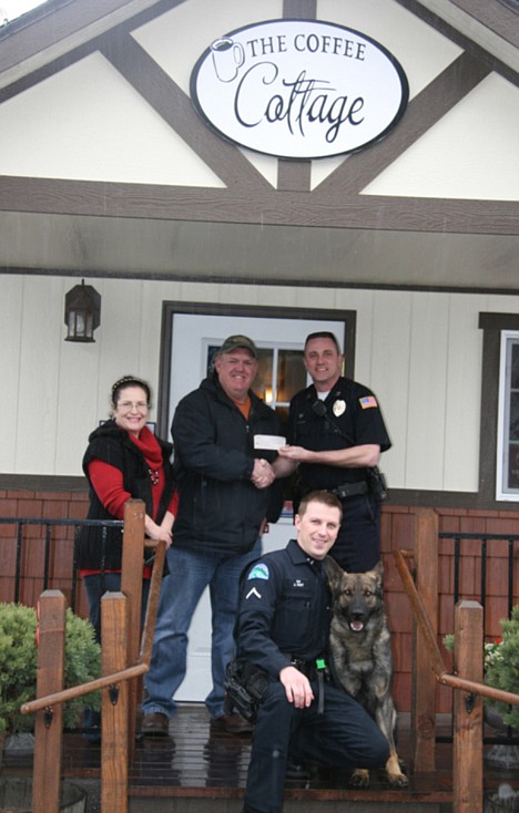 &lt;p&gt;A fundraiser through Coffee Cottage in Post Falls recently raised $600 toward a bulletproof vest for Andor, Post Falls Police's newest K-9. The business contributed $300 and patrons $300. Front row are Officer Jason Hunt and Andor. Back row are Angie and Tom Alexander, owners of the business, and Capt. Pat Knight. The vest will cost $2,100 and this is the initial funds toward the purchase.&lt;/p&gt;