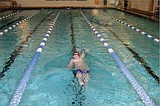 Swimmer captures state titles, heads to regional meet
