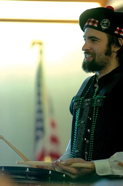 Great Scots' band member Dylan Foley accompanies his team in the song &quot;Scotland the Brave,&quot; as performed at the Irish Celebration in the Heritage of Faith Church.