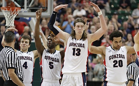 &lt;p&gt;Gonzaga players from left, Kevin Pangos (4), Gary Bell Jr. (5), Kelly Olynyk (13) and Elias Harris (20) celebrate in the closing minutes of their win over Saint Mary's in the West Coast Conference championship game last Monday in Las Vegas.&lt;/p&gt;