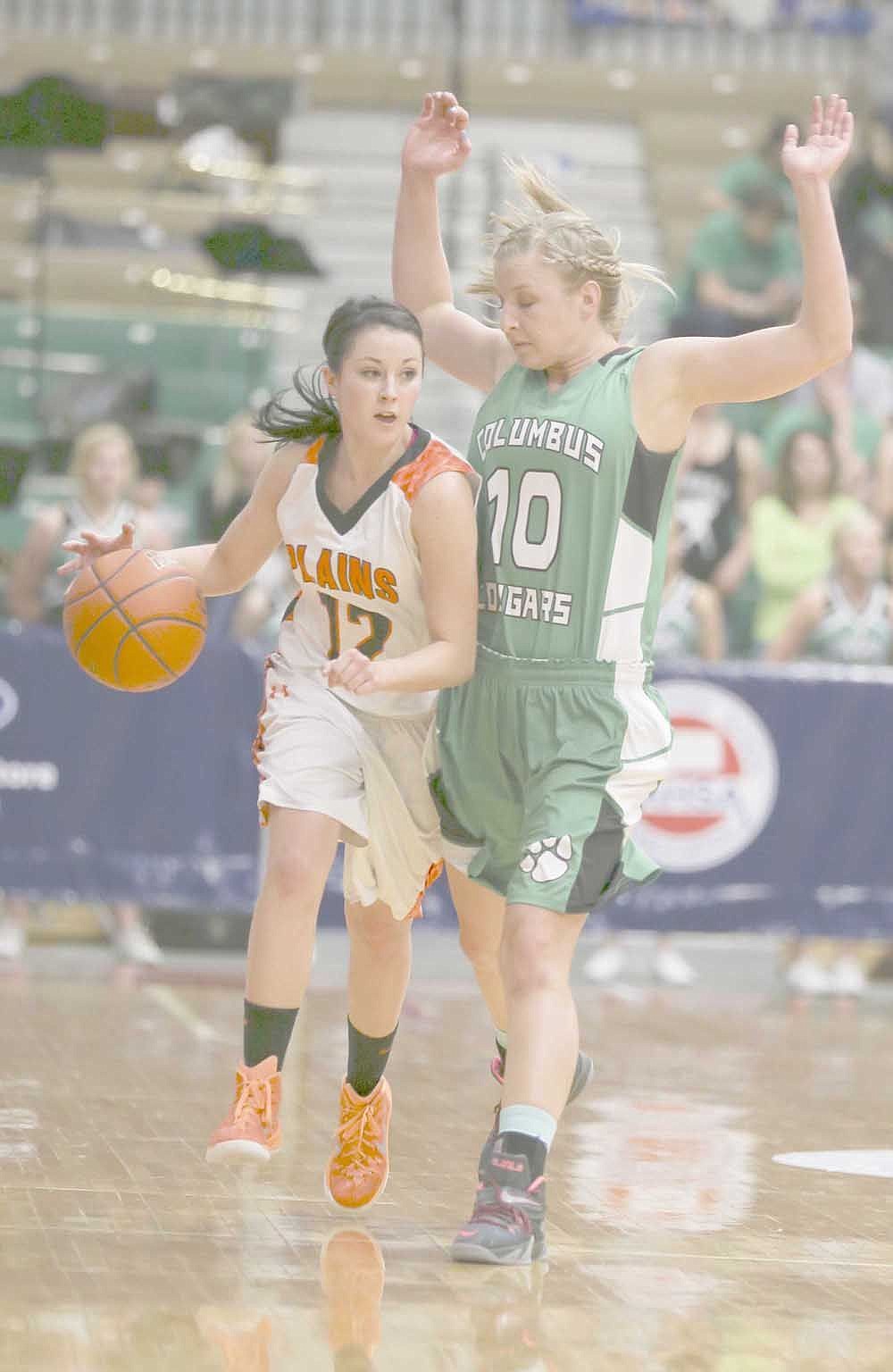 &lt;p&gt;Sami Kinzie drives against Columbus defender Kayla Rouanne during loser out action at the Class B state tournament in Great Falls.&lt;/p&gt;