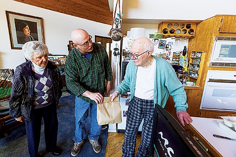 &lt;p&gt;Betty Ann Henderson joins volunteer Mark Jones, alternative to suspension coordinator for the Post Falls School District, to deliver a meal to Philip Bruno, far right, as part of the Meals on Wheels program.&lt;/p&gt;