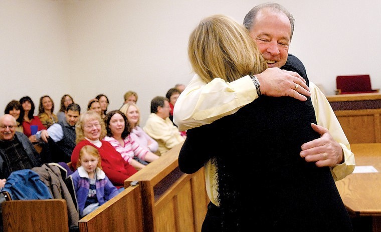 &lt;p&gt;Flathead County Commissioner Jim Dupont and Clerk of Court Peg Allison embrace each other before taking their oaths of office in Flathead County District Court on Dec. 31, 2008. Judge Ted Olympus swore in both officials.&lt;/p&gt;