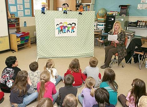 Photos by Ed Moreth Plains teacher Wendy Starkey works with a group of puppets to talk about bullying to kindergartners at Wildhorse Plains School.