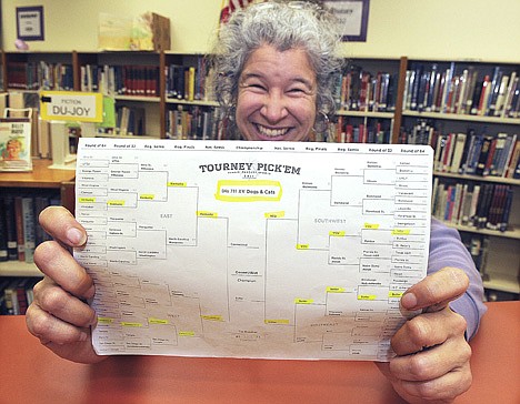 &lt;p&gt;In this March 31, 2011 file photo, Jefferson High School librarian Diana Inch displays her winning NCAA tournament bracket from Yahoo.com's online contest in Jefferson, Ore. The odds of completing the perfect bracket by picking the higher-seeded team are 35 billion to 1.&lt;/p&gt;