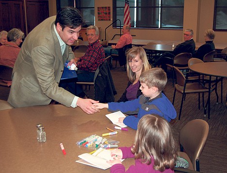 Rep. Raul Labrador, R-Idaho, greets Kylen Claridge, who attended Friday&#146;s question-and-answer session with his mother, Kara, and his sister, Evie. (Photo CAMERON RASMUSSON)