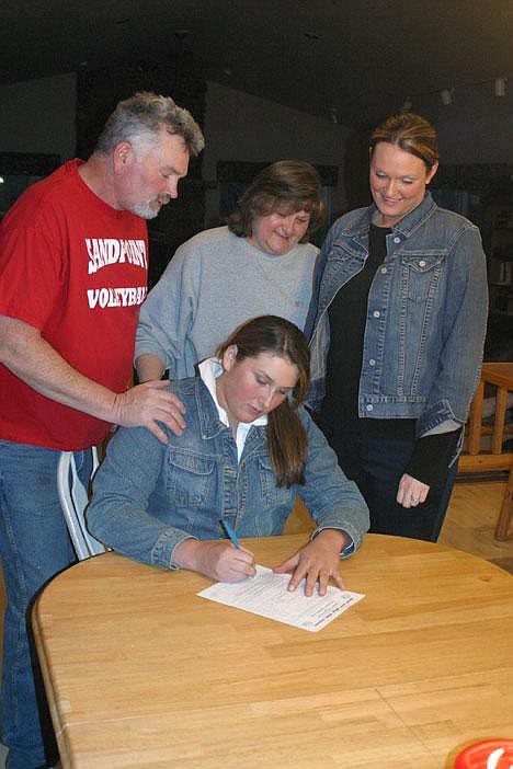 &#151;Photo by ROGER BRANSCOME&lt;br&gt;Caitlyn Free signs her letter of intent to play volleyball for North Idaho College next fall.