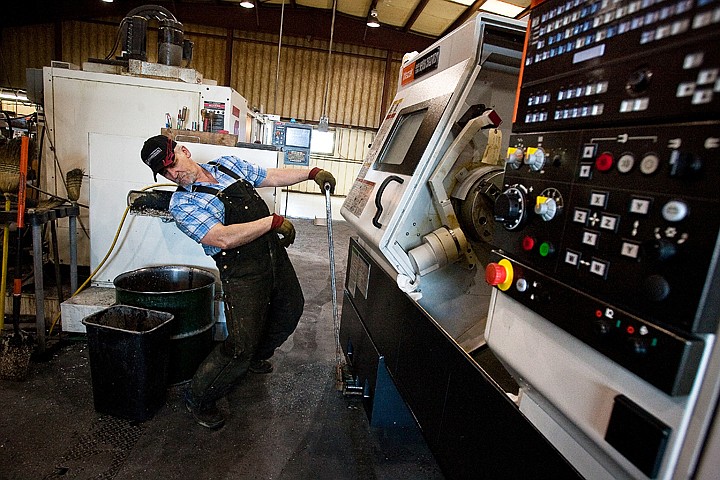 &lt;p&gt;Chris Nicol, plant manager for LA Aluminum Casting Company, checks his clearance while installing a new casting machine Thursday, February 4 at the Hayden manufacturing facility. The twin spindle live tool turning center cost $300,000 and will allow the plant increased production for its multi-million dollar military contract work.&lt;/p&gt;