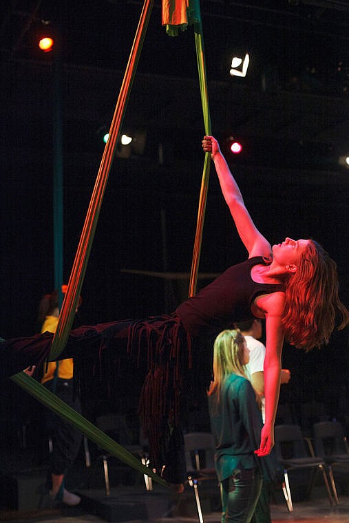 <p>Anika Fritz practices aerial stunts during a rehearsal for "Tarzan" at Glacier High School. </p>