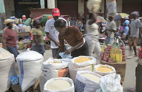 &lt;p&gt;Maria Carmelle Jean, center, sells rice and dry products at a downtown street market in Port-au-Prince, Saturday, March 20, 2010. Decades of cheap imports, especially rice from the U.S., punctuated with abundant aid in various crises, have destroyed local agriculture and left impoverished countries such as Haiti unable to feed themselves. (AP Photo/Jorge Saenz)&lt;/p&gt;