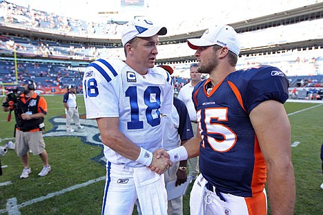 &lt;p&gt;FILE - In this Sept. 26, 2010 file photo, Indianapolis Colts quarterback Peyton Manning (18) greets Denver Broncos quarterback Tim Tebow (15) at an NFL game, in Denver. Manning is negotiating to join the Broncos, ESPN reported Monday, March 19, 2012. Citing anonymous sources, ESPN said that the four-time MVP has instructed agent Tom Condon to negotiate the details of a deal with Denver. (AP Photo/Greg Trott) MANDATORY CREDIT MAGS OUT TV OUT&lt;/p&gt;