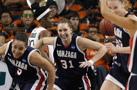 &lt;p&gt;Gonzaga's Shannon Reader (31) smiles as she turns around to head back up court after scoring against Miami in the first half of an NCAA tournament second-round women's college basketball game in Spokane, Wash., Monday, March 19, 2012. (AP Photo/Elaine Thompson)&lt;/p&gt;