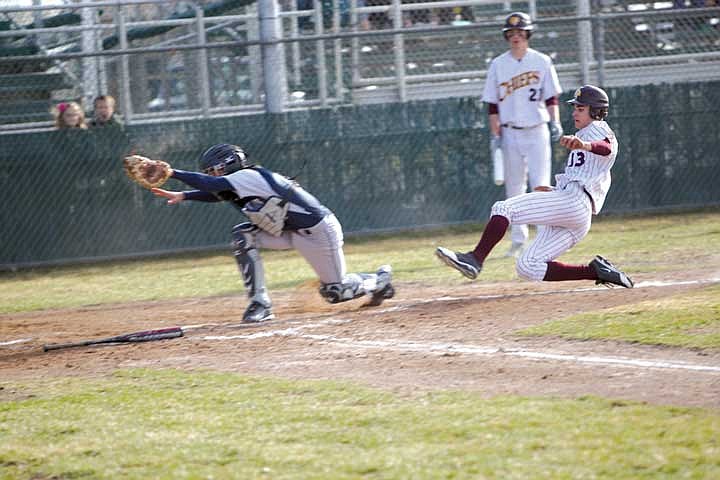 Tyson Karstetter beats the throw home in the second inning against Mt. Spokane.