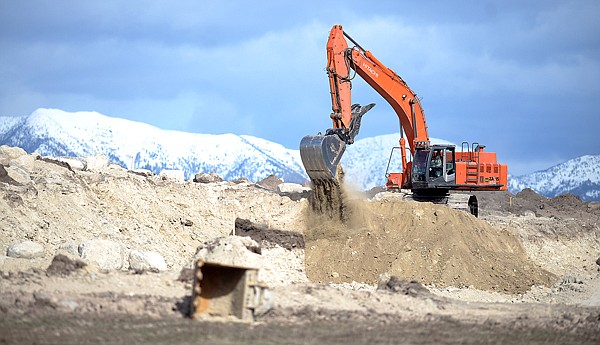 An excavator works on the Highway 93 Bypass on Wednesday, March 17, off of Foys Lake Road in Kalispell.