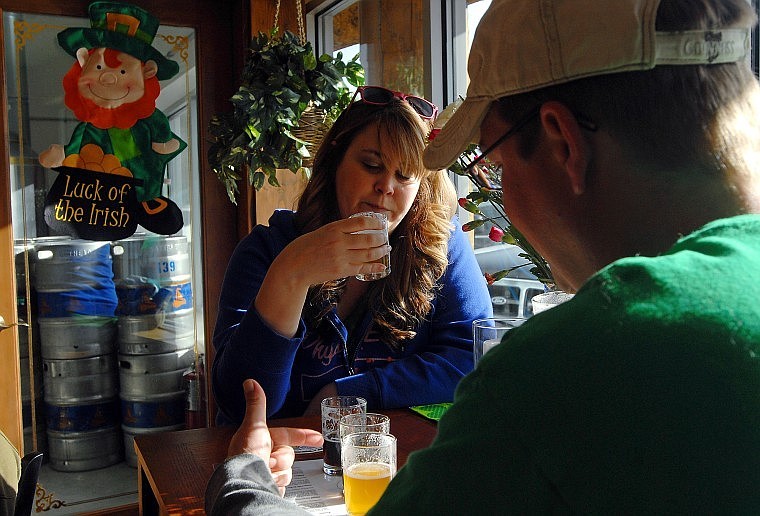 Darcie Fast tastes a few beer samples with her husband Dan Fast at Flathead Lake Brewing Company in Woods Bay Wednesday afternoon. The two said they enjoyed the Pale Ale the most, saying it had &quot;a clean after taste&quot; and &quot;a smooth finish&quot;. The Brewery will be celebrating it's grand re-opening this Saturday.