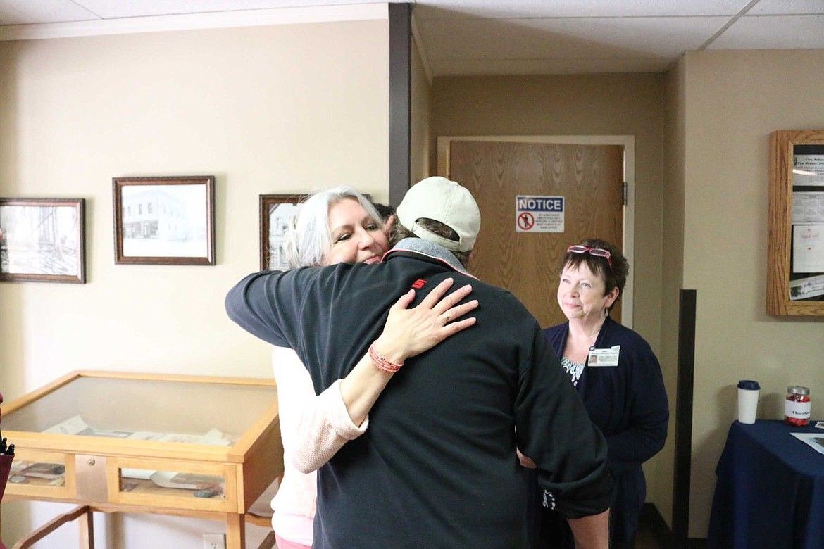 &lt;p&gt;Connie Schoening gets a hug from Mike Stager after a raffle drawing at MCH last week.&lt;/p&gt;