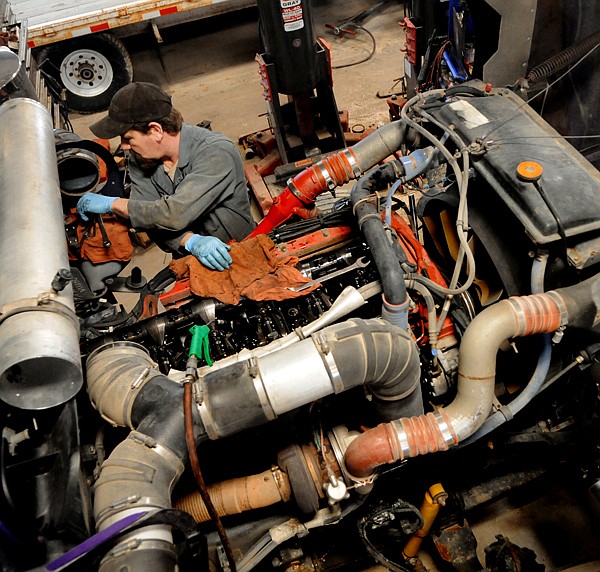 &lt;p&gt;Chris Commers, a mechanic at Northwest Truck Repair, works on the engine of an semi truck on Tuesday, March 6, in Kalispell.&lt;/p&gt;