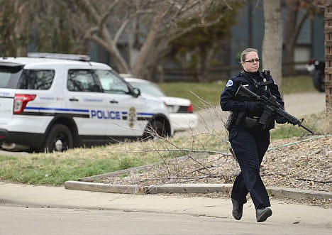 &lt;p&gt;Longmont Police arrive at the scene of a stabbing on Wednesday, in Longmont, Colo. Dynel Lane, 34, is accused of stabbing a pregnant woman in the stomach and removing her baby, while the expectant mother visited her home to buy baby clothes advertised on Craigslist, authorities said.&lt;/p&gt;