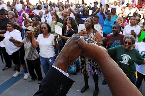 &lt;p&gt;Rev. Glenn Dames, senior pastor at St. James AME Church, leads people in a prayer at the Titusville Courthouse on Sunday, March 18, 2012, in Titusville, Fla. A rally was held demanding justice for Trayvon Martin, a black Florida teenager fatally shot by a white neighborhood watch volunteer. No charges have been filed in the February death. (AP Photo/Florida Today, Craig Rubadoux) NO SALES; MAGS OUT; MANDATORY CREDIT: FLORIDATODAY.COM&lt;/p&gt;