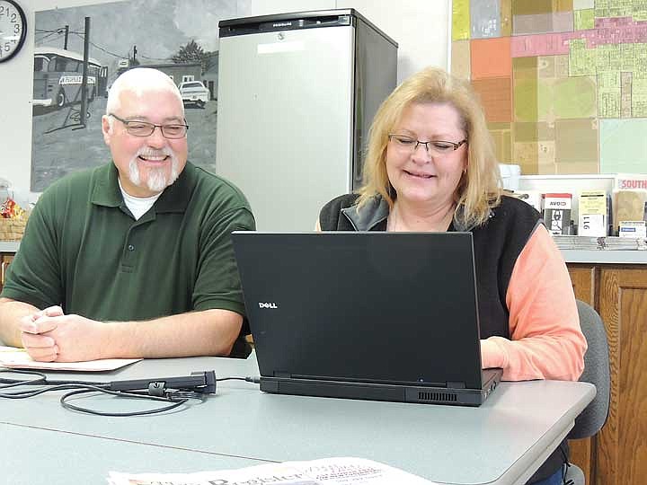 Retired Adams County Sheriff Doug Barger and current Grant County Sheriff's Department Support Specialist Leslie Gonzales near the finish of the cleanup of the Mattawa PD evidence room.