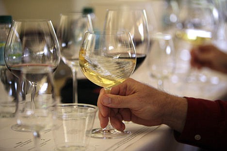 &lt;p&gt;In this May 20, 2009 photo a glass of white wine is swirled during a tasting in Oakville, Calif. More than two dozen California vintners are facing a lawsuit claiming their wines contain dangerously high levels of arsenic. The industry group Wine Institute dismissed the allegations as &quot;false and misleading.&quot;&#160;&lt;/p&gt;