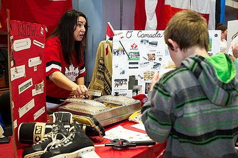 &lt;p&gt;Lynne Fullbrook shares some of her Canadian heritage with visitors Saturday at the Multicultural Faire at Lakes Magnet Middle School. Fullbrook works for the Coeur d&#146;Alene School District as an instructional coach moved to the United States from Canada in 1996.&lt;/p&gt;