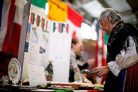 &lt;p&gt;Giuliana Rogers looks over her Italian expressed table wearing an original costume made in Sardegna, Italy.&lt;/p&gt;