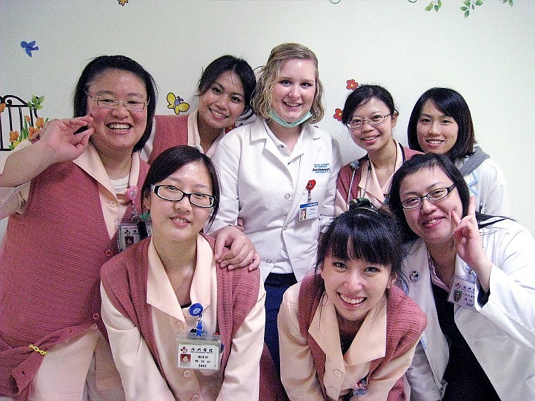 Solum poses with nurses in the pediatric unit at Cheng Hsin Hospital in Taipei. Northwest University has sent students to learn at the hospital for nine years. &#147;The doctors were amazing &#151; you could talk to them about anything,&#148; Solum said. &#147;While doing a procedure, they would explain what they were doing and why they were doing it.&#148;