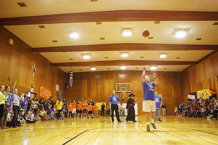 &lt;p&gt;Gene Boyle competes in the free throw contest Friday night during the Holy Hoops tournament at St. Matthew School. Friday, March 15, 2013 in Kalispell, Montana. (Patrick Cote/Daily Inter Lake)&lt;/p&gt;