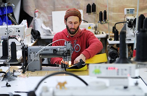 &lt;p&gt;Revelate Designs' Eric Parsons sews frame bag components in his garage workshop in Airport Heights, Alaska, Dec. 30, 2013.&lt;/p&gt;