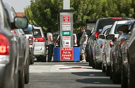 &lt;p&gt;Costco members fill up with discounted gasoline at a Costco gas station in Van Nuys, Calif., in October. U.S. oil output rose 14 percent to 6.5 million barrels per day in 2012, a record increase, but you'd never know it from the price at the pump. The national average price of gasoline is $3.69 per gallon and it is forecast to creep higher and could approach $4 by May.&lt;/p&gt;