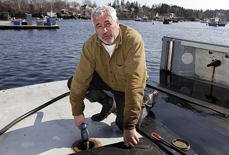 &lt;p&gt;Third generation lobsterman Craig Rogers fuels up his lobster boat Tuesday at Mackeral Cove in Bailey Island, Maine. Rogers, of Harpswell, said high fuel prices are the biggest concern of lobstermen today.&lt;/p&gt;