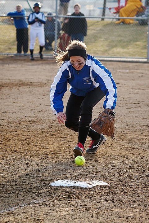 &lt;p&gt;Kyeli Parker, third baseman for Coeur d'Alene, fields a ground ball against Lake City.&lt;/p&gt;