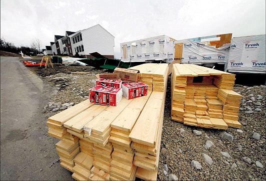 &lt;p&gt;In this Feb 20 photo, a new residential construction is shown in Canonsburg, Pa. New home? Or existing one? For buyers, the decision is getting easier. A wave of foreclosures has sent prices of previously occupied homes sinking. New-home prices have fallen much less.&lt;/p&gt;