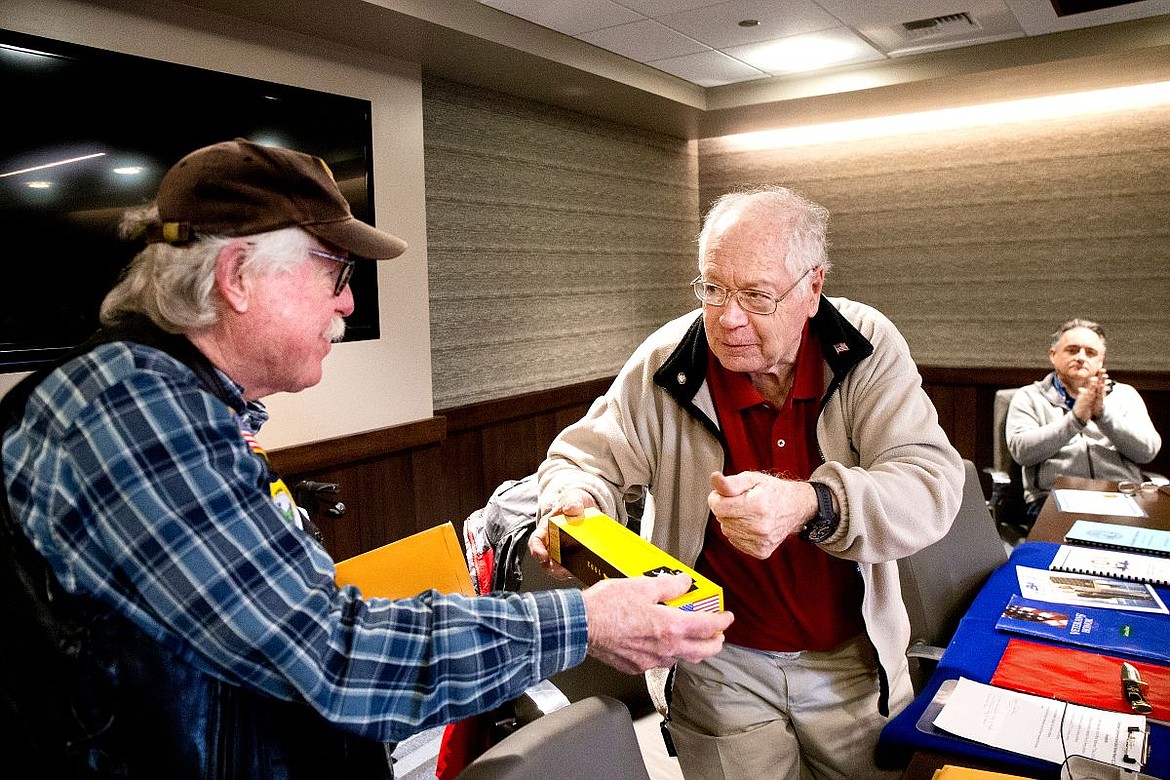 &lt;p&gt;At left, U.S. Navy veteran Pete Oakander, who served in Vietnam, is handed a commemorative Buck sheath knife by Graham Crutchfield on Tuesday at the Coeur d'Alene Press office.&lt;/p&gt;