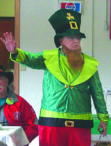 The leprechaun, played by Roger Brown, tells folk that they'll never find where he has hidden  his pot of gold.