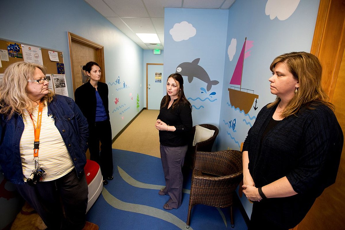 &lt;p&gt;From left to right, mental health clinician Sheri Weistaner, Executive Director of Safe Passage Katie Coker, Children's Advocacy Center Director Tamarah Cardwell and forensic investigator Janet Pace stand in the waiting room of the Children's Advocacy Center in Coeur d'Alene on Tuesday.&lt;/p&gt;