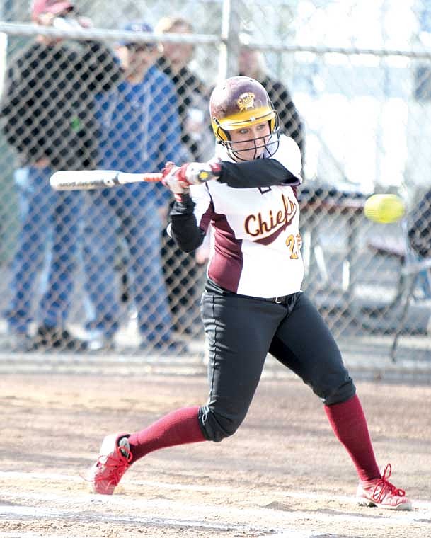 Moses Lake catcher Tressa Radach attempts to make contact with a pitch against Lewis and Clark at Larson Softball Field Thursday. Radach finished 2-4 and the Chiefs won 10-1.