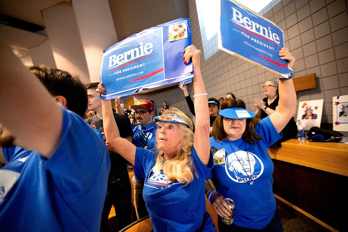 &lt;p&gt;Elizabeth Rose, center, and Nancy Burtard cheer and show their support for democratic presidential hopeful Bernie Sanders on Tuesday at the democratic caucus held at North Idaho College.&lt;/p&gt;