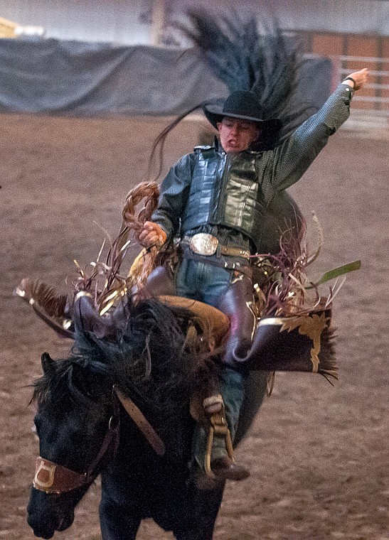 <p>Zeke Thurston of Sheridan, Wyo., rides saddle bronc Friday night during the first night of the Rocky Mountain Classic PRCA Rodeo at Majestic Valley Arena. March 21, 2014 in Kalispell, Montana. (Patrick Cote/Daily Inter Lake)</p>